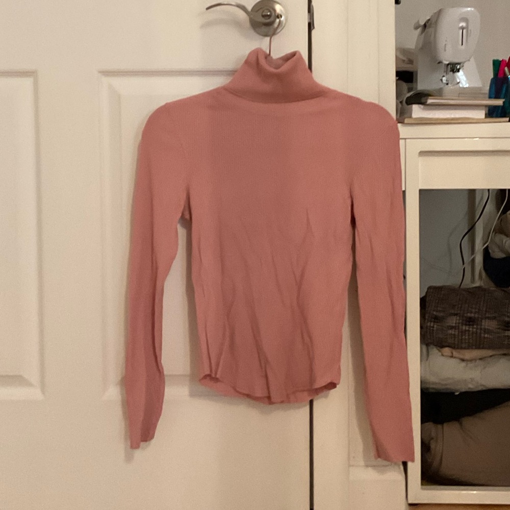 pink turtleneck
